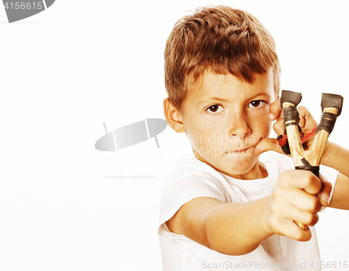 Image of little cute angry real boy with slingshot isolated