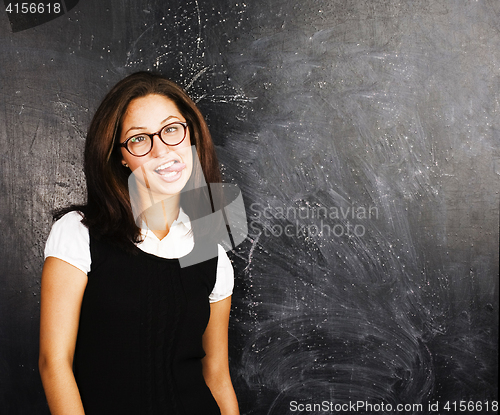 Image of portrait of happy cute student in classroom at blackboard back to school, crazy emotional, lifestyle people concept