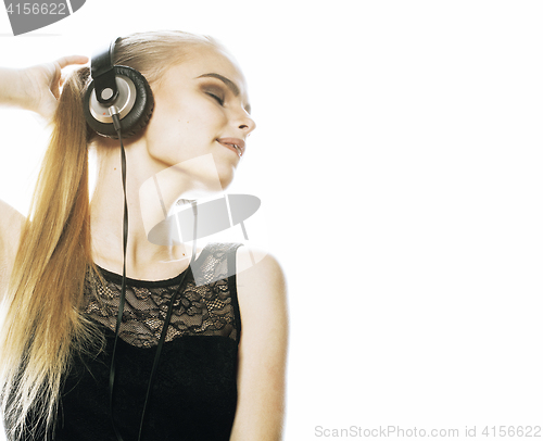 Image of young sweet talented teenage girl in headphones singing isolated