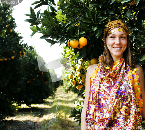 Image of pretty islam woman in orange grove smiling, real muslim girl