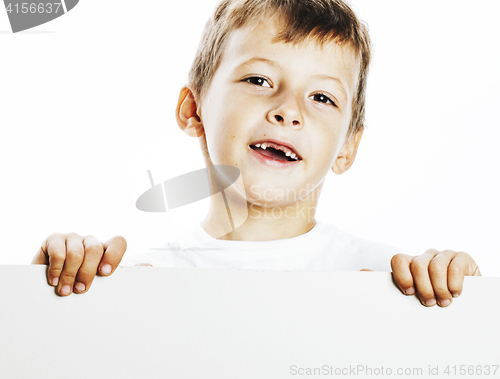 Image of little cute boy holding empty shit to copyspace isolated close u