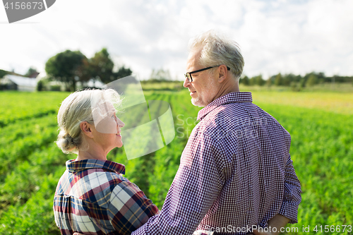 Image of happy senior couple at summer farm