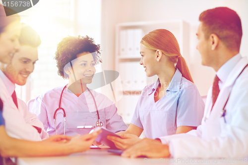 Image of group of happy doctors meeting at hospital office