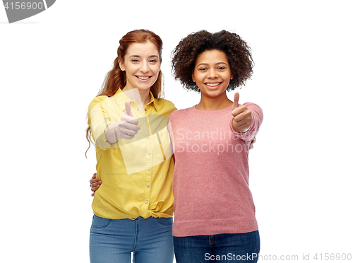 Image of happy smiling women showing thumbs up