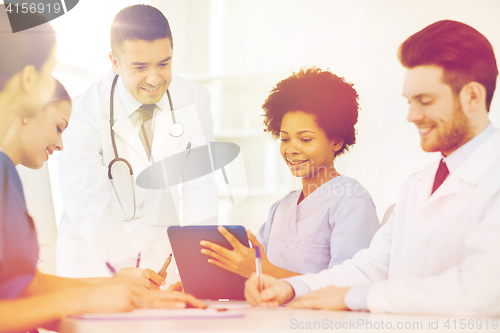 Image of group of happy doctors meeting at hospital office