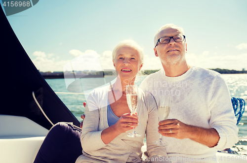 Image of senior couple with glasses on sail boat or yacht