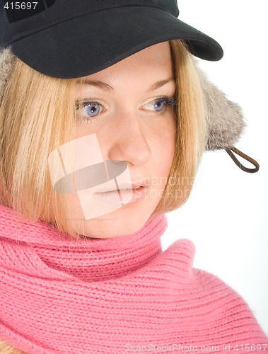 Image of blue-eyed blonde in fur cap and  pink scarf