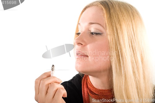 Image of young beautiful girl smoking cigarette
