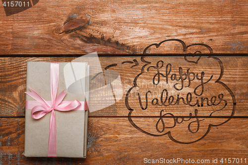 Image of Valentines Day gift   on wooden background