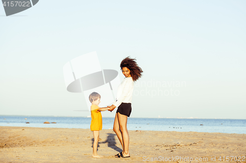 Image of pretty diverse nation and age friends on sea coast having fun, lifestyle people concept on beach vacations