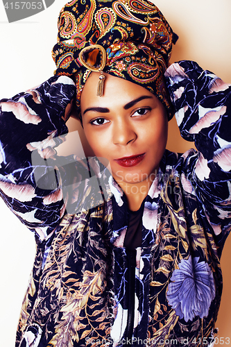 Image of beauty bright african woman with creative make up, shawl on head