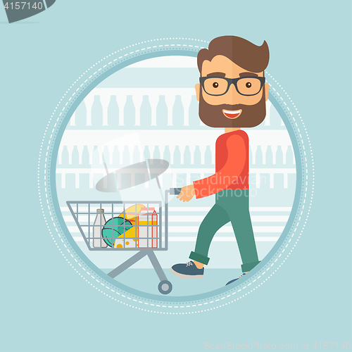 Image of Customer walking in store with shopping trolley.