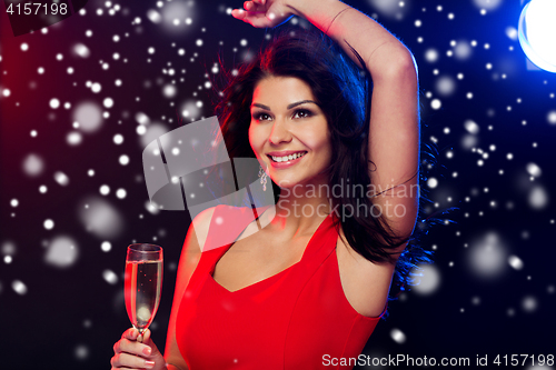 Image of beautiful woman with champagne glass at nightclub