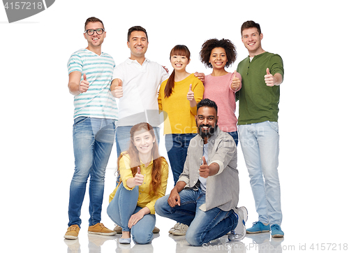Image of international group of people showing thumbs up