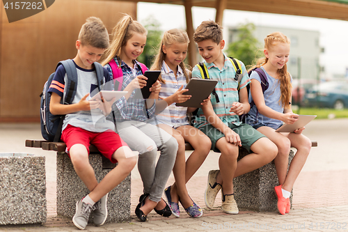 Image of group of happy elementary school students talking