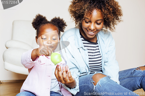 Image of adorable sweet young afro-american mother with cute little daugh