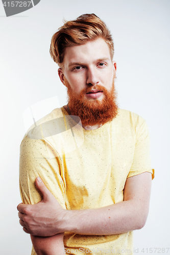 Image of young handsome hipster ginger bearded guy looking brutal isolated on white background, lifestyle people concept