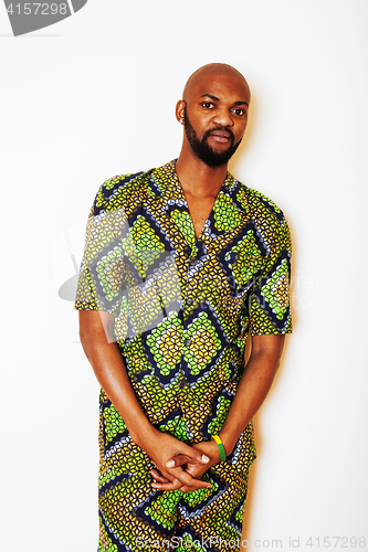 Image of portrait of young handsome african man wearing bright green nati