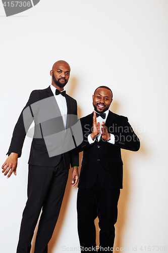 Image of two afro-american businessmen in black suits emotional posing, g