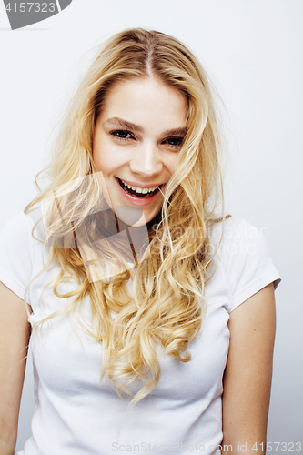 Image of young pretty blond teenage girl emotional posing, happy smiling isolated on white background, lifestyle people concept