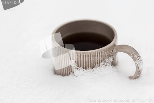 Image of tea or coffee mug in snow