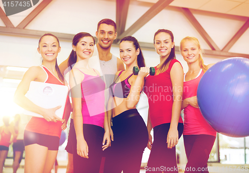 Image of group of smiling people in the gym