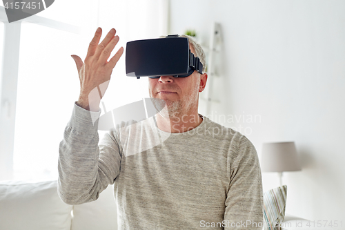 Image of old man in virtual reality headset or 3d glasses