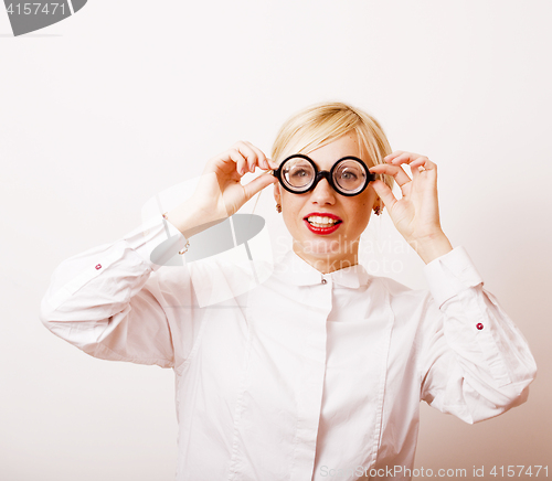 Image of bookworm, cute young blond woman in glasses, blond hair, teenage