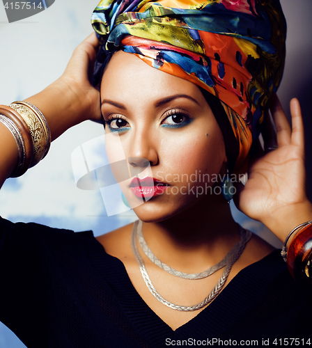 Image of beauty bright african woman with creative make up, shawl on head