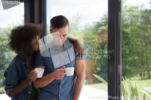 Image of romantic happy young couple relax at modern home indoors