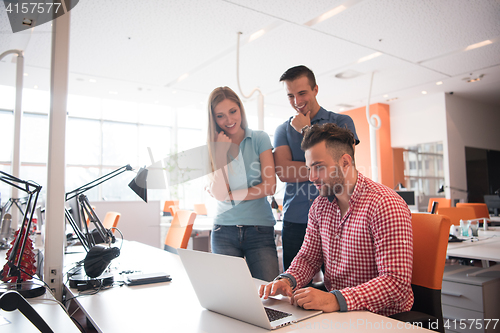 Image of Group of young people employee workers with computer