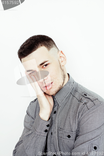 Image of young handsome well-groomed guy posing emotional on white background, lifestyle people concept