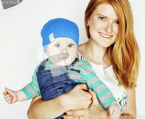 Image of young beauty mother with cute baby, red head happy modern family