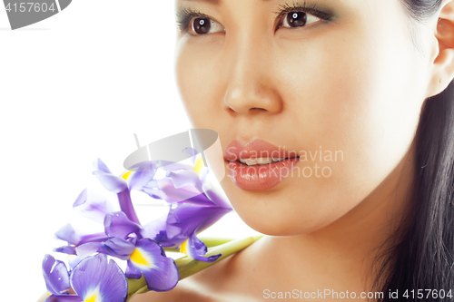 Image of young pretty asian woman with flower orchid close up isolated spa