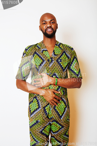 Image of portrait of young handsome african man wearing bright green nati