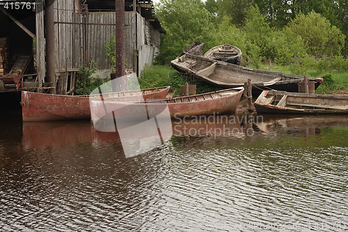 Image of Old fish boats at the shore