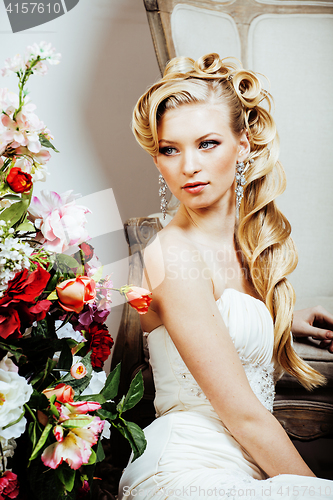 Image of beauty young bride alone in luxury vintage interior with a lot of flowers close up