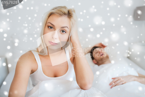 Image of awake woman having insomnia in bed