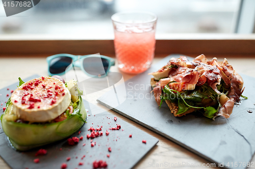 Image of goat cheese and ham salads on cafe table