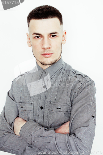 Image of young handsome well-groomed guy posing emotional on white background, lifestyle people concept