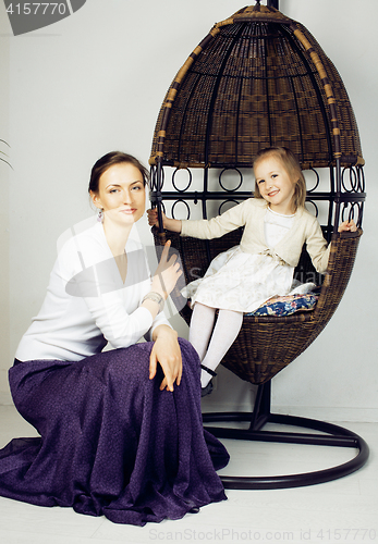 Image of young mother with daughter at luxury home interior vintage