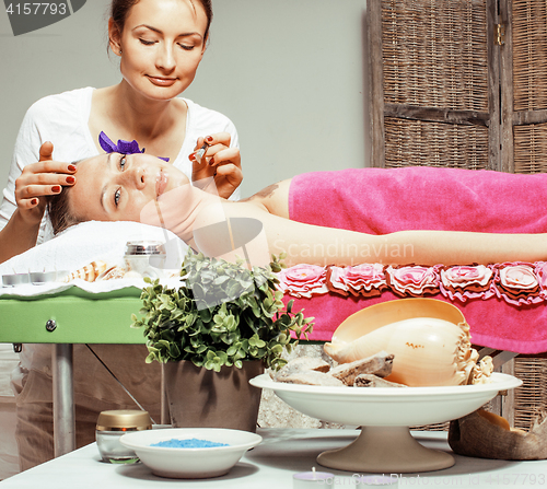 Image of stock photo attractive lady getting spa treatment in salon, healthcare people concept 