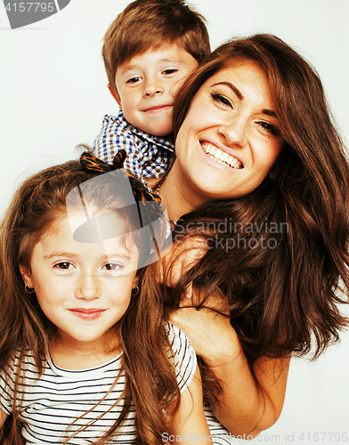 Image of two pretty children kissing their mother happy smiling close up,