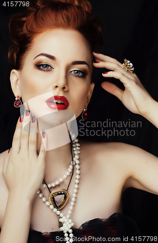 Image of beauty stylish redhead woman with hairstyle and manicure wearing jewelry pearl close up