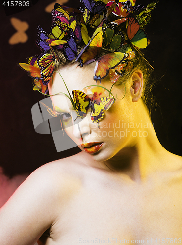 Image of woman with summer creative make up like fairy butterfly closeup 