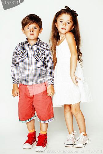 Image of little cute boy and girl hugging playing on white background, ha