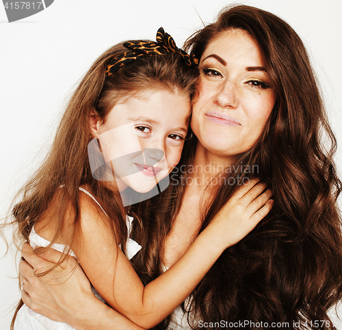 Image of young mother with little cute daughter emotional posing on white