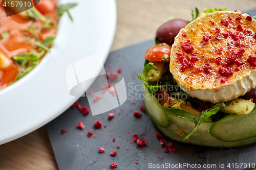 Image of goat cheese salad with vegetables at restaurant