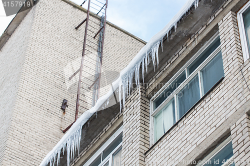 Image of icicles on building or living house facade