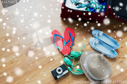 Image of close up of travel bag with clothes and stuff